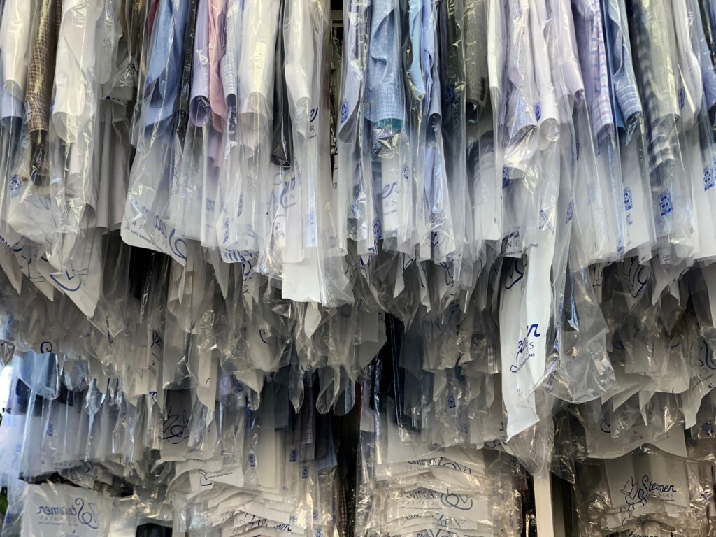 Dry cleaning clothes hanging up