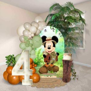 Mickey Mouse-themed Balloon decor, with light up marquee number, cake stand, and greenery. Oregon Balloon Decor