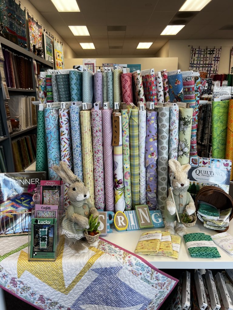 Spring Display at The Cotton Patch - Bunnies, Fabrics, Table Runner, quilt squares, baskets, and quilting books
