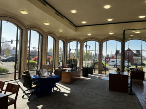 Inside view of the WaFd bank North Salem, Oregon - showing arched windows on front and side of building - desks and meeting table