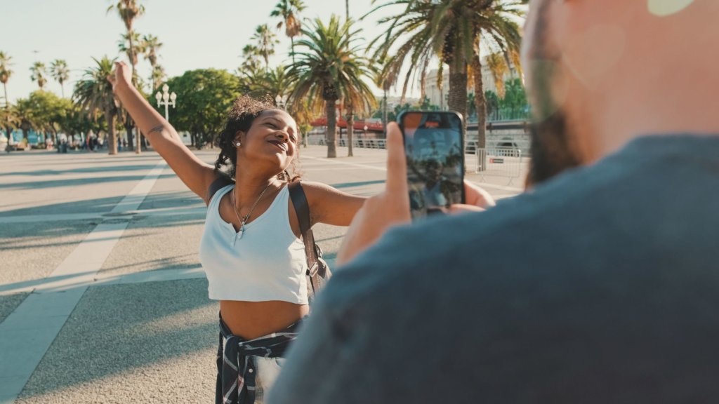 Woman dancing outside in front of camera