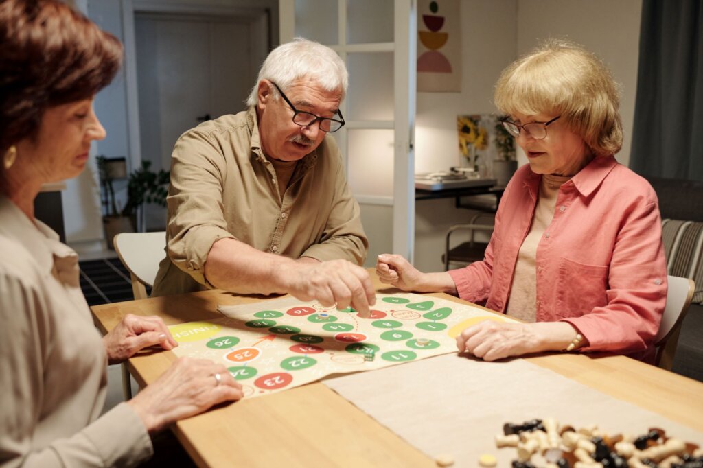 Seniors playing a table game