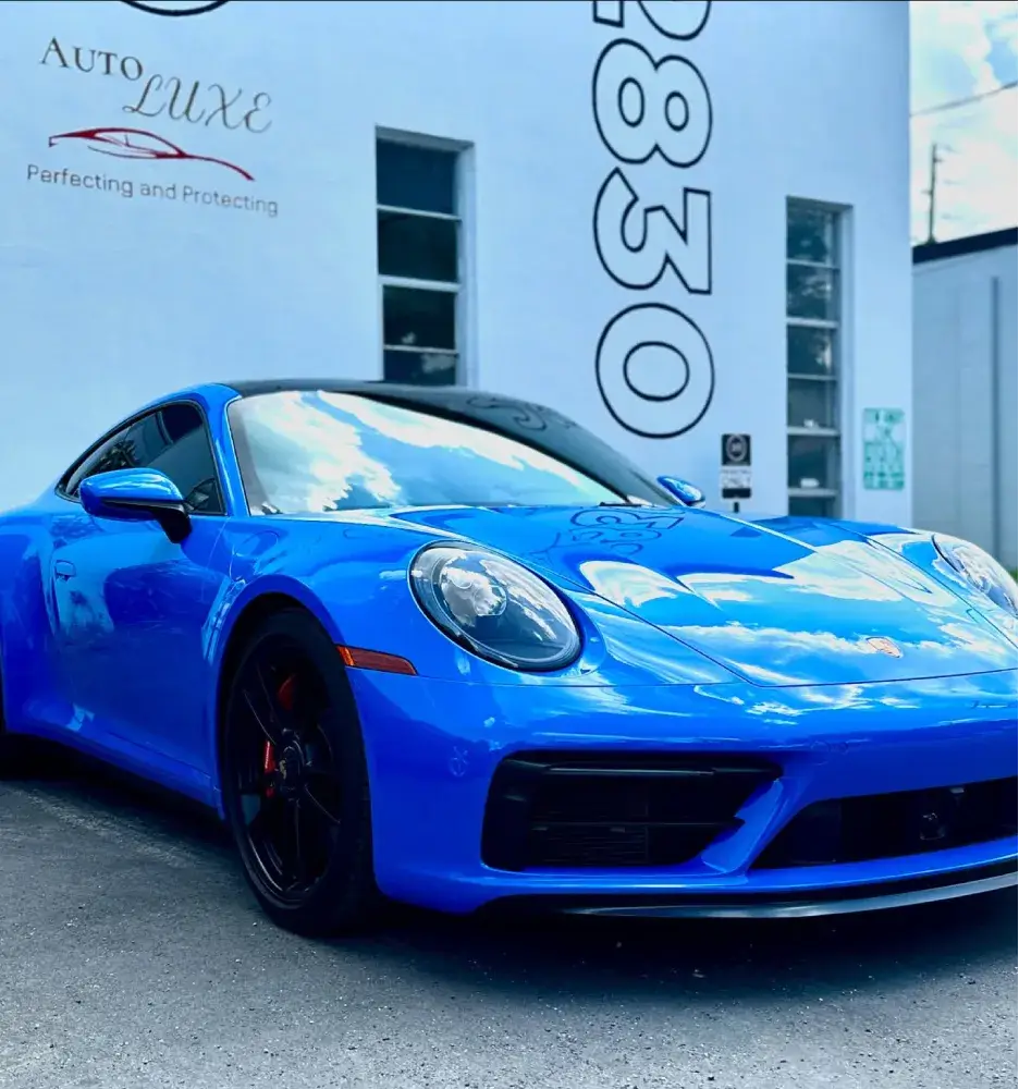 Blue Porsche parked outside Auto Luxe studio for ceramic coating St. Petersburg FL.