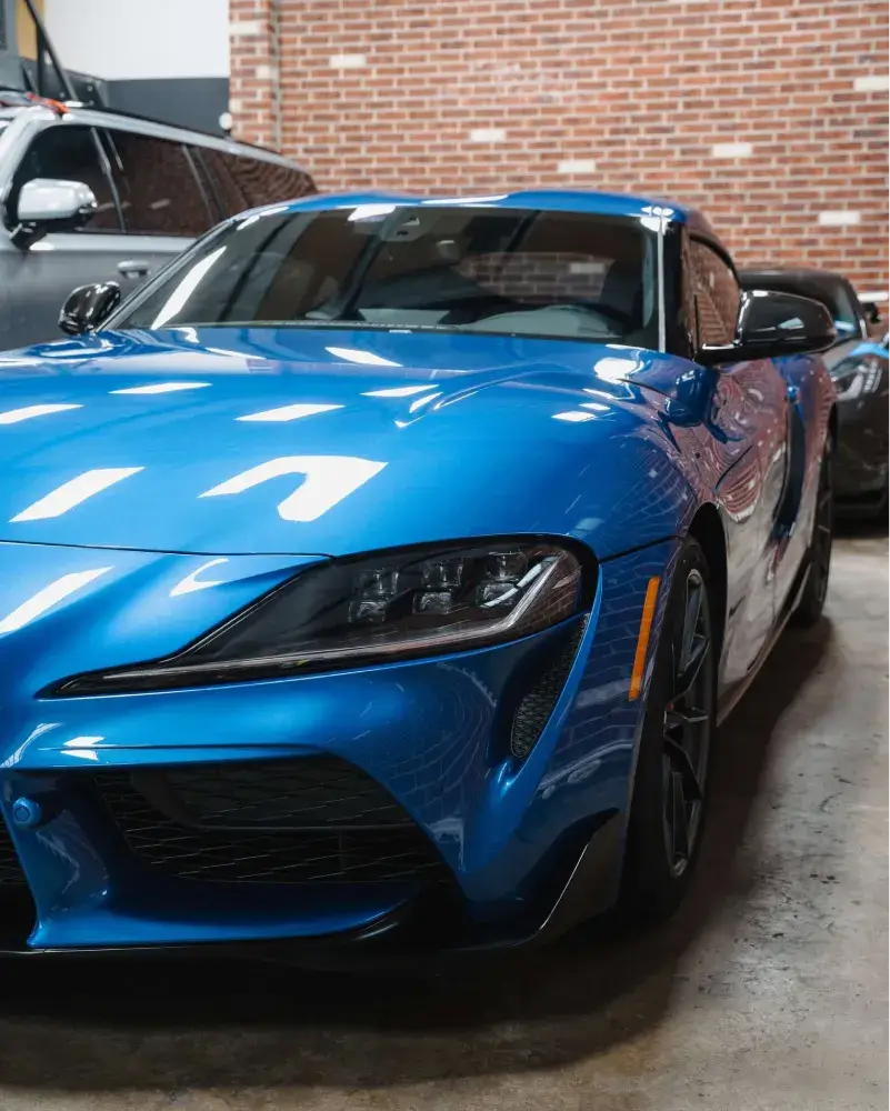 Blue Toyota Supra with high-gloss finish protected by ceramic coating.