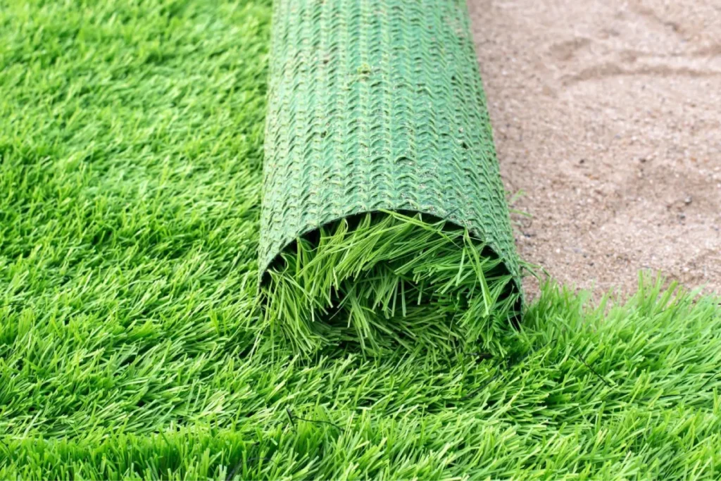 Partial roll of green synthetic grass for an artificial turf installation.