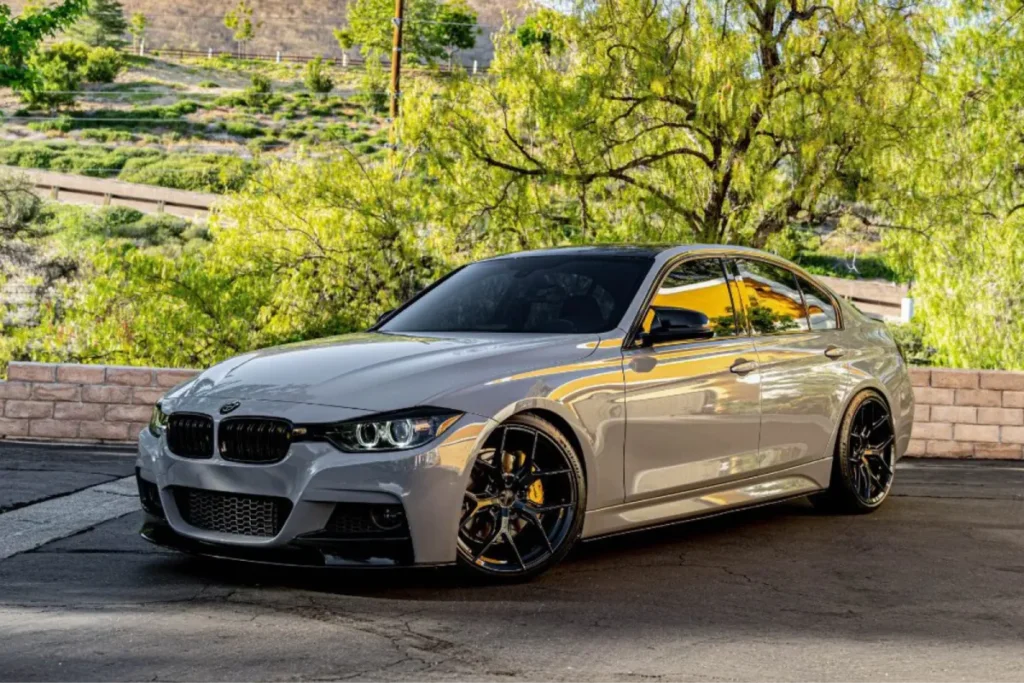 Grey BMW sedan parked outdoors, demonstrating a full vehicle wrap.