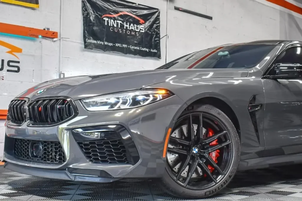 Grey BMW inside a shop receiving professional ceramic coating in Fort Lauderdale, FL.