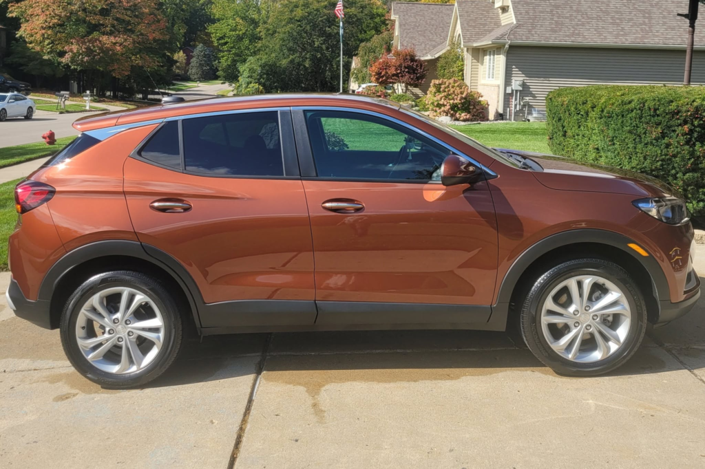 Orange Buick Encore with a glossy ceramic coating finish.