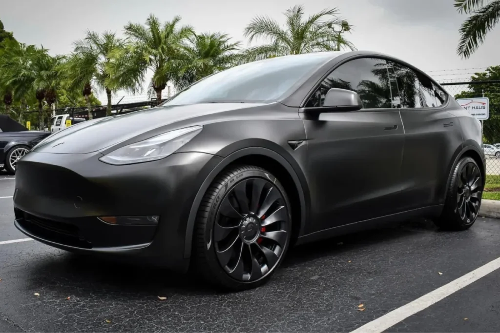 Matte black Tesla Model Y protected with matte paint protection film. Matte black Tesla Model Y protected with matte paint protection film.