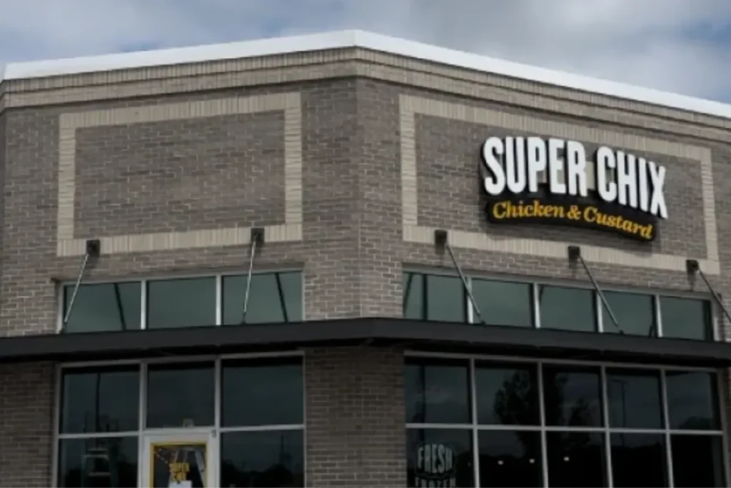 Commercial storefront exterior with large glass windows featuring protective window film.