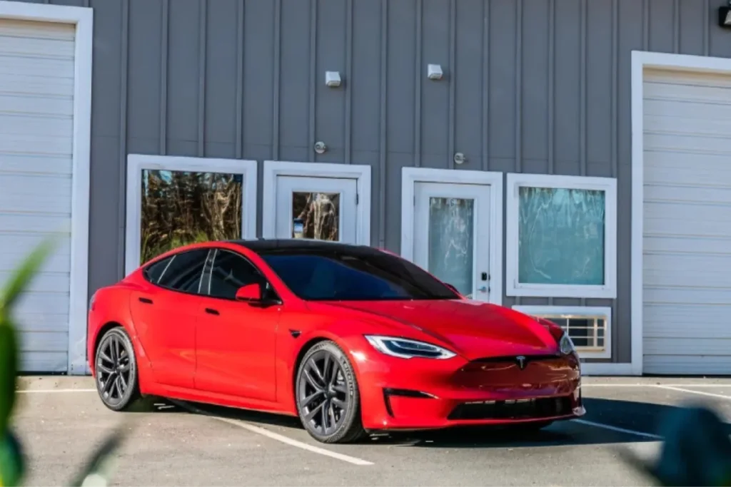 Red Tesla Model S with dark ceramic window tinting Charlotte, NC
