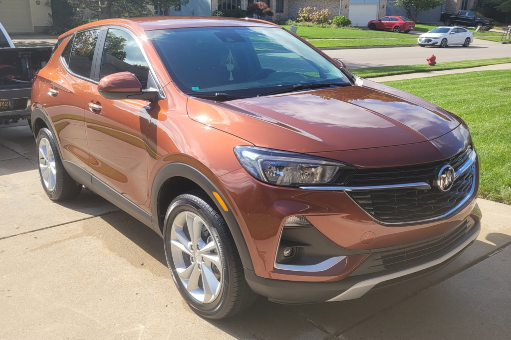 Detailed orange SUV with a glossy exterior finish.