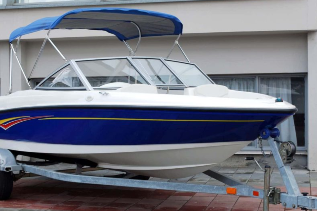 Boat detailing on a blue and white boat.
