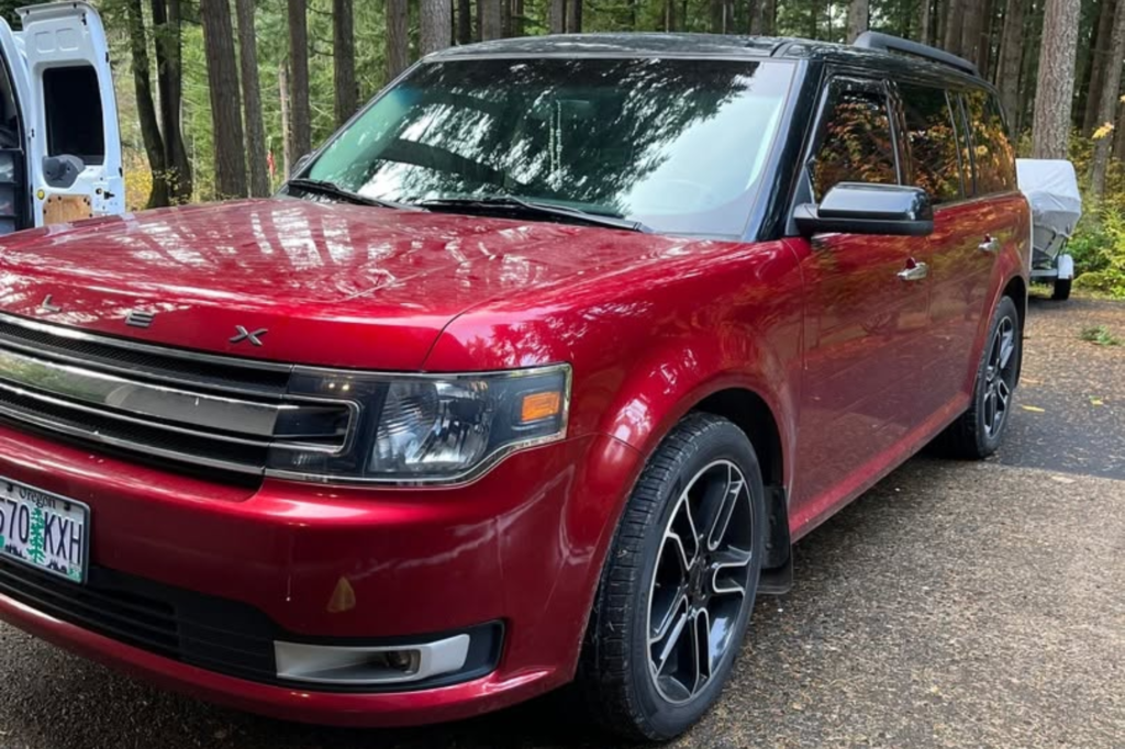 Red SUV with a glossy finish after ceramic coating.