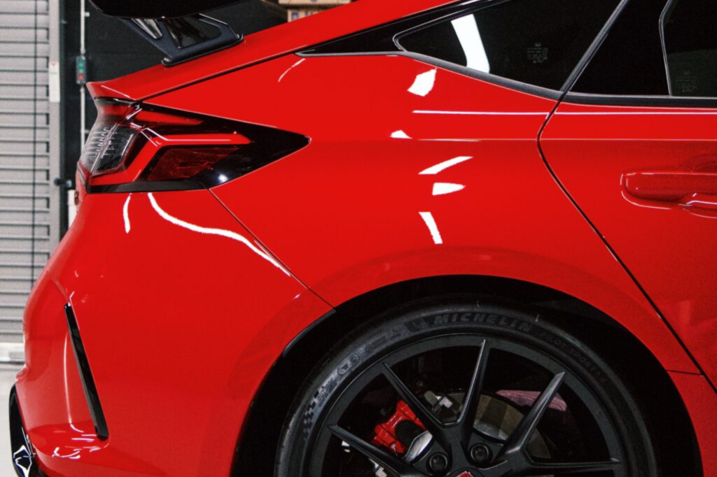 Ceramic-coated red sports car with a high-gloss finish.
